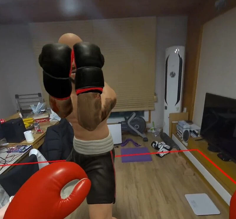 Boxing with a virtual character inside a house using a pass-through.
