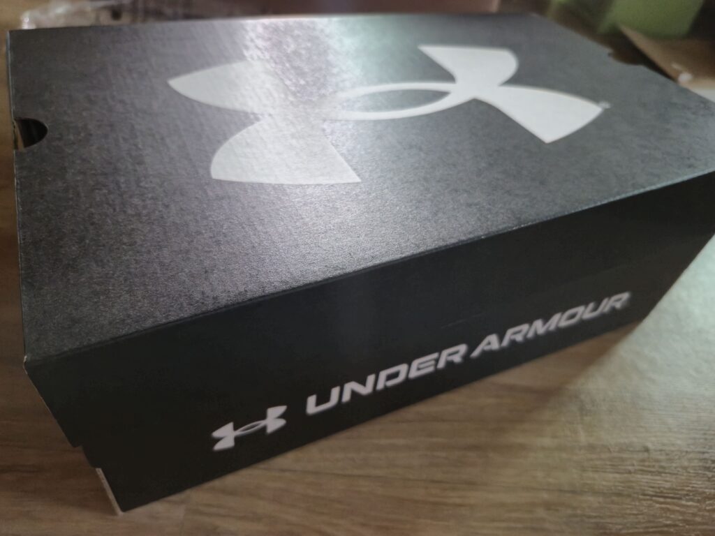 A black Under Armour shoe box.