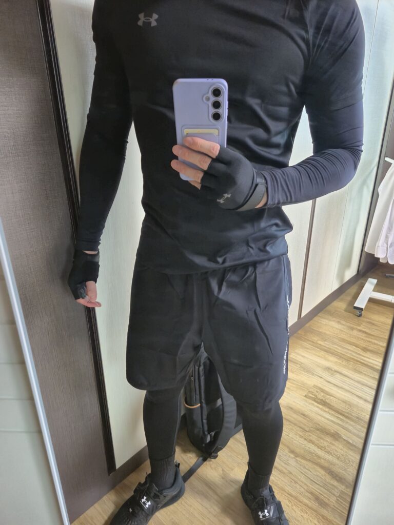 Wearing a full set of Under Armour, color coordinated with black.